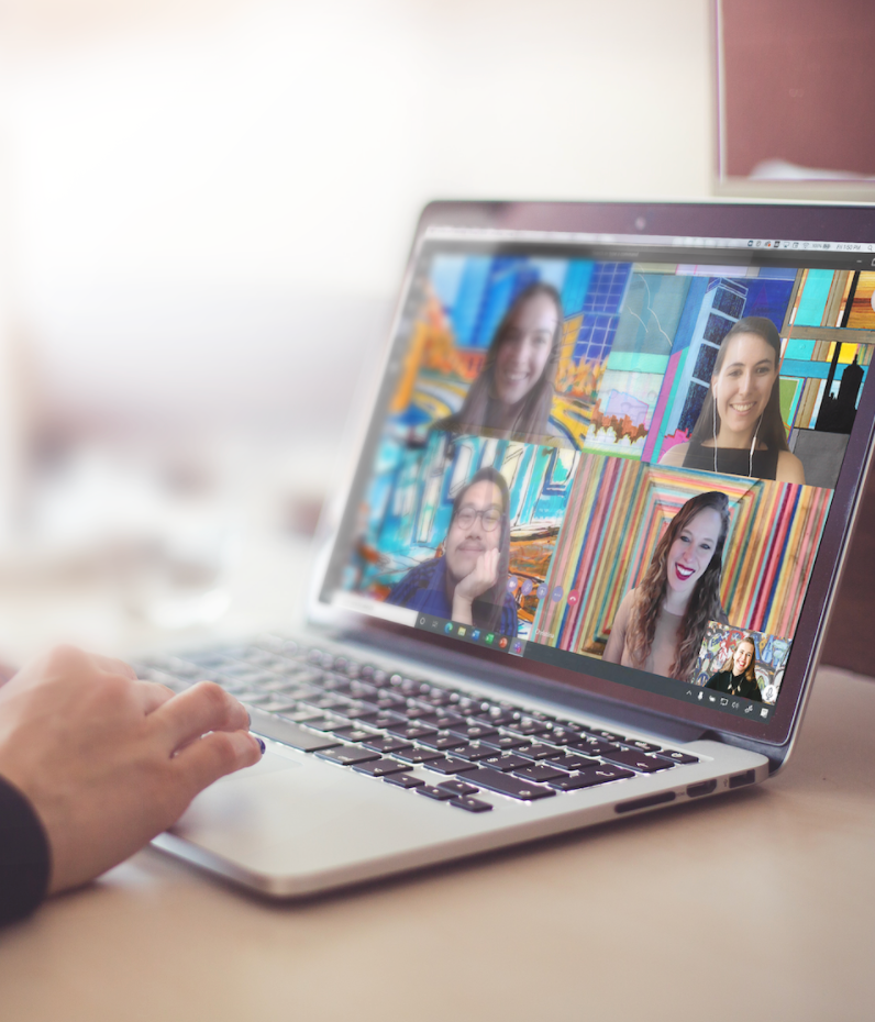 A laptop screen showing a virtual call where participants have art as their background.